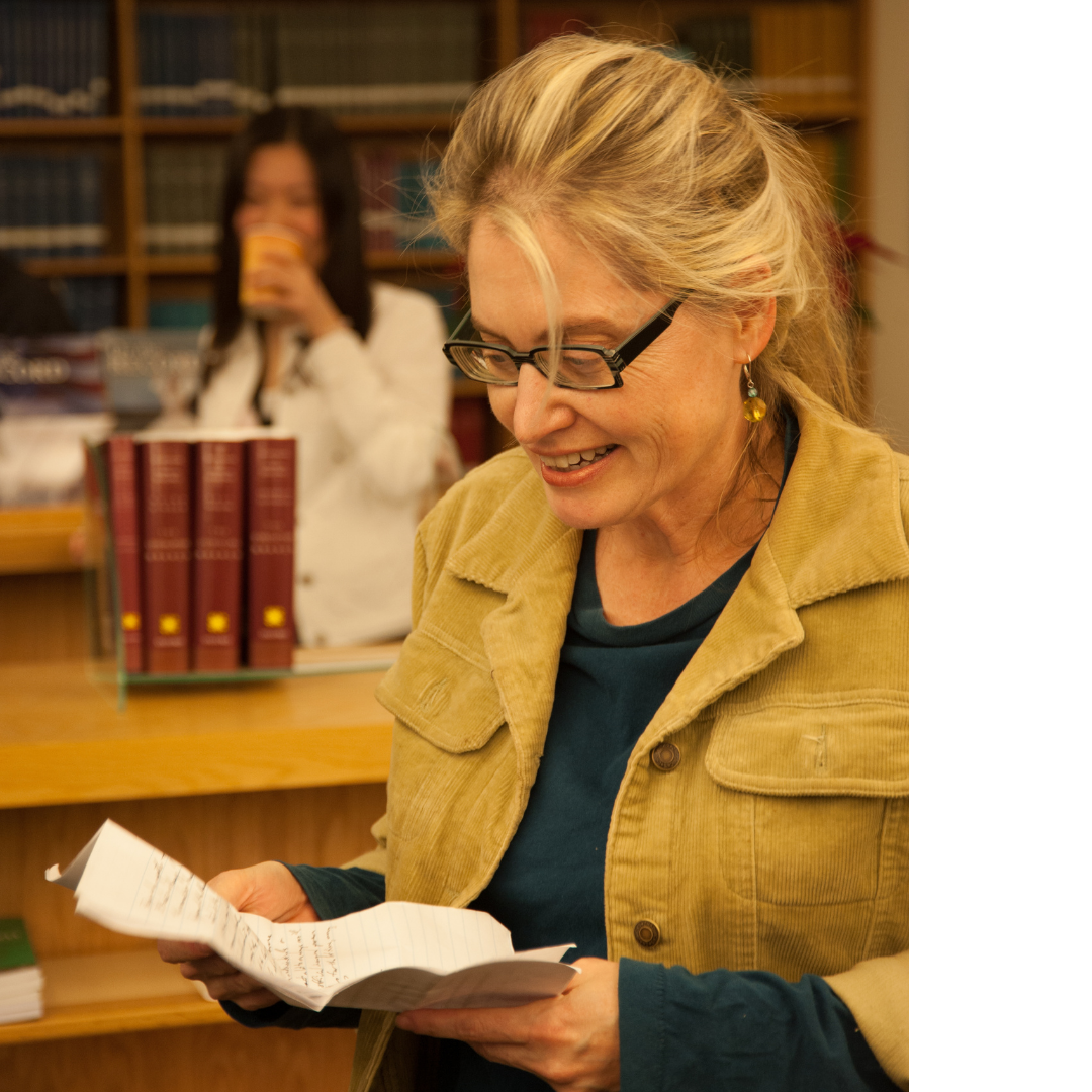 Sharon Black is reading in the library.