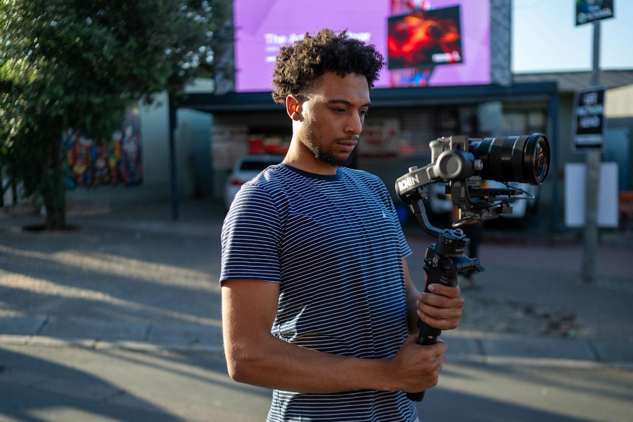 Shelton Mercer holding video camera