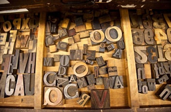 Drawer full of letter stamps for a printing press.