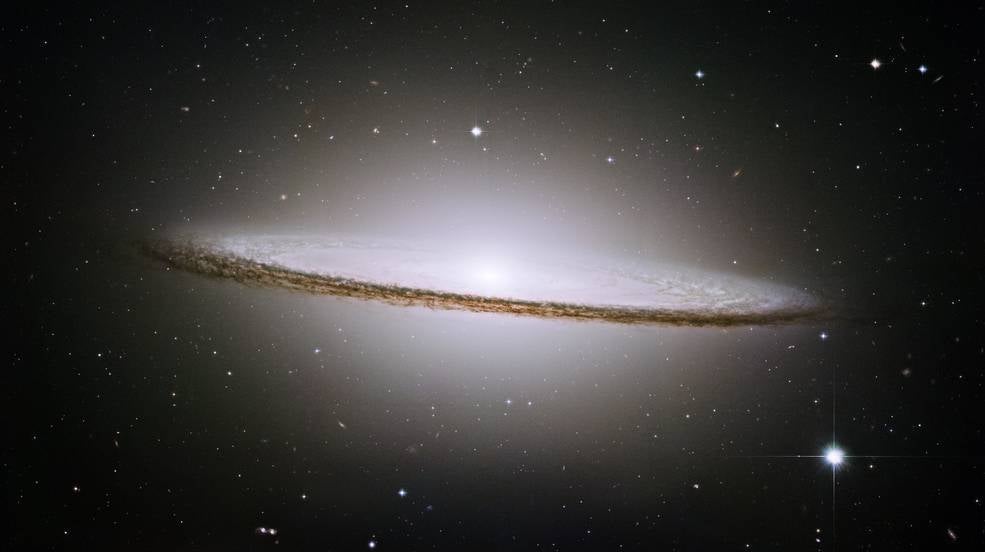 Photograph of Messier 104, also called the Sombrero Galaxy. Credits: NASA and the Hubble Heritage Team.