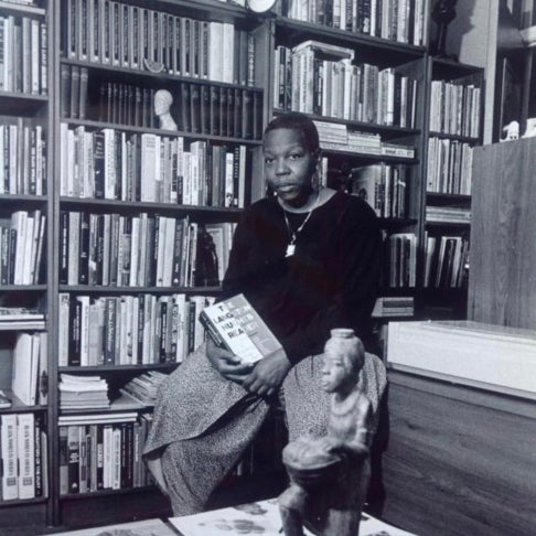 Banks seated in front of her collection, ca. 1990s.