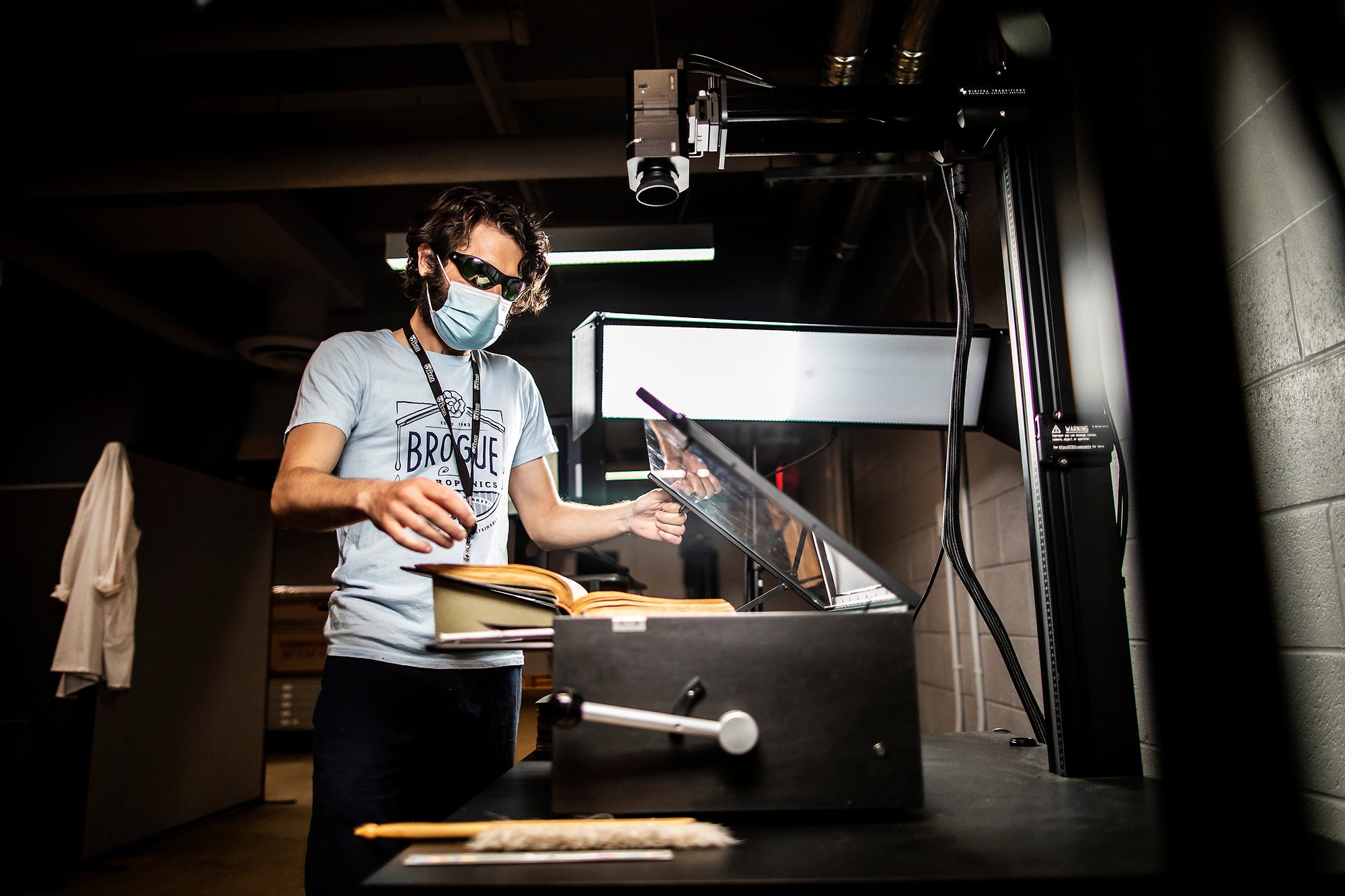 SCETI employee scanning a book