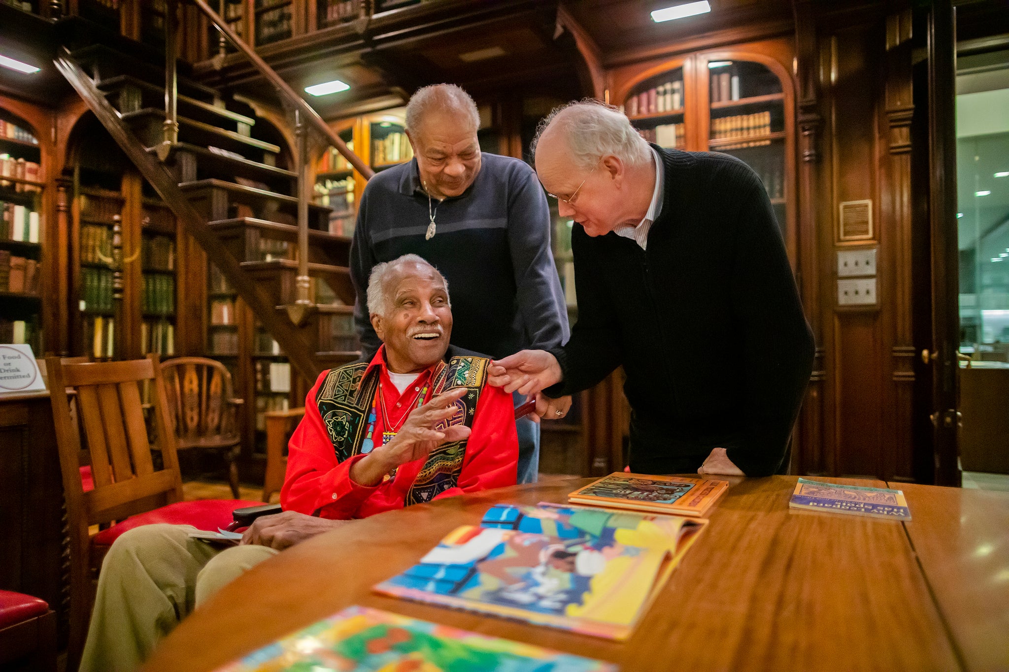 Picture of three old people in Van Pelt Library.