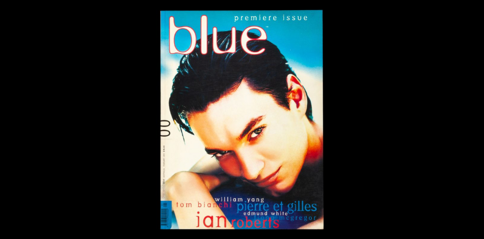 The cover of the first issue of the magazine Blue on the front cover, showing a man with dark hair looking at the camera in a sultry manner.