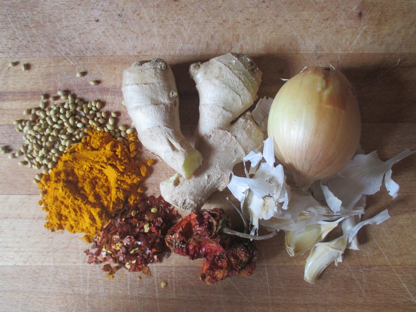 Fresh herbs and spices on cutting board