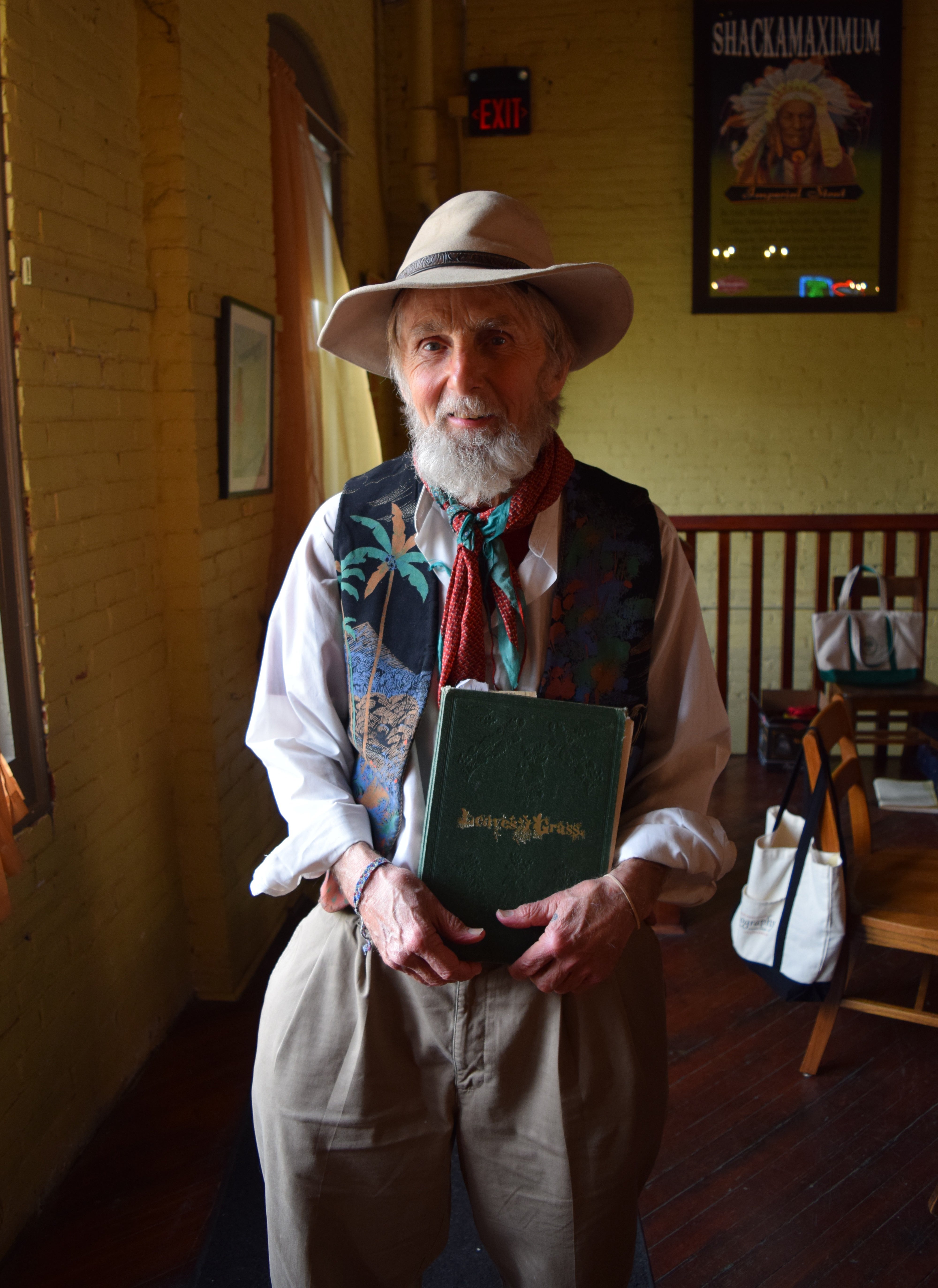 Poet Rocky Wilson holding Leaves of Grass.